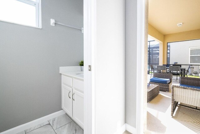 bathroom with tile flooring and vanity