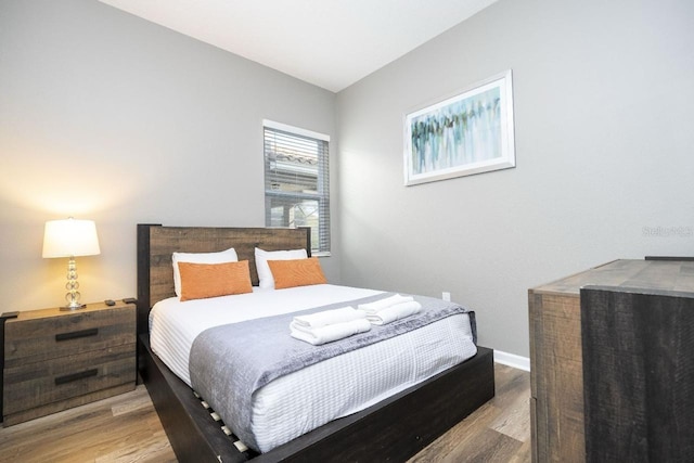 bedroom with light wood-type flooring