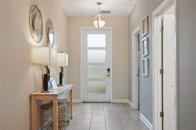 8834 Cabot Cliffs Dr, Davenport, FL 33896 - entryway featuring baseboards and light tile patterned floors