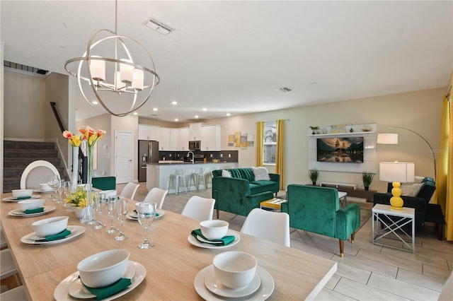 dining area with a notable chandelier and light tile patterned flooring