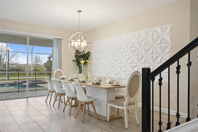 tiled dining space featuring a chandelier