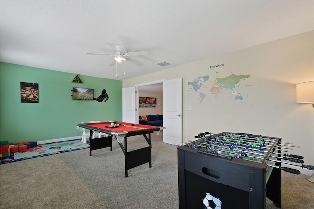 recreation room featuring carpet and ceiling fan