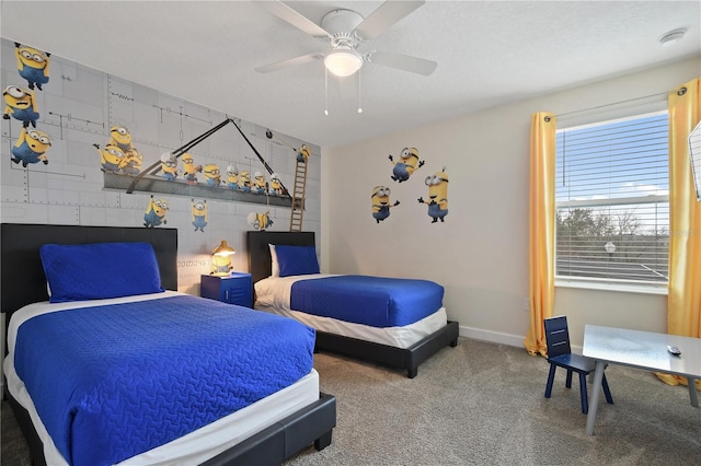 carpeted bedroom featuring a textured ceiling and ceiling fan