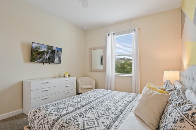 bedroom featuring ceiling fan and light colored carpet