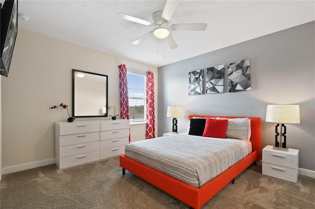 bedroom with dark carpet and ceiling fan