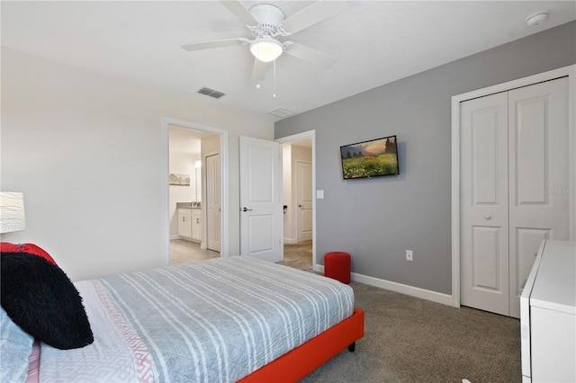 carpeted bedroom featuring a closet and ceiling fan