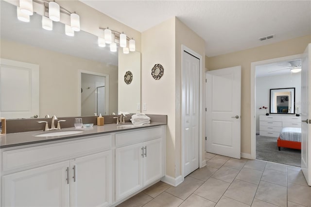 bathroom with tile patterned floors, ceiling fan, and vanity