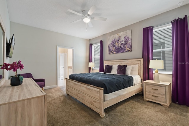 bedroom featuring connected bathroom, ceiling fan, and carpet