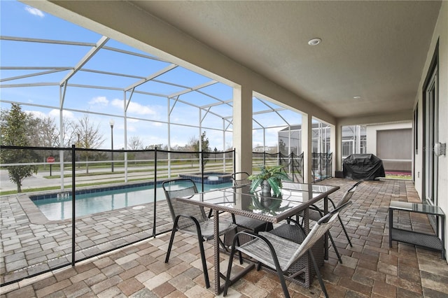 view of patio featuring area for grilling and a lanai