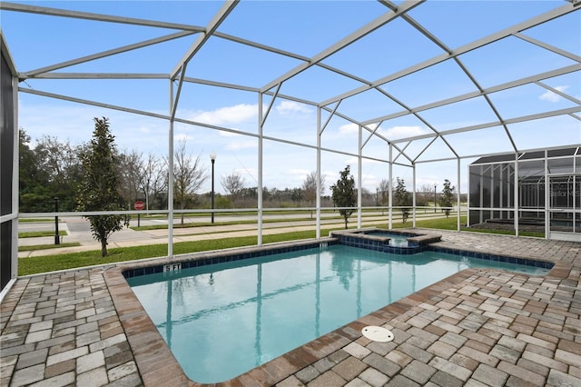 view of swimming pool featuring a patio and a lanai