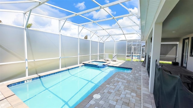 8834 Cabot Cliffs Dr, Davenport, FL 33896 - view of swimming pool with a patio, a pool with connected hot tub, and a lanai