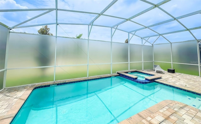 8834 Cabot Cliffs Dr, Davenport, FL 33896 - view of pool featuring a pool with connected hot tub, a patio, and glass enclosure