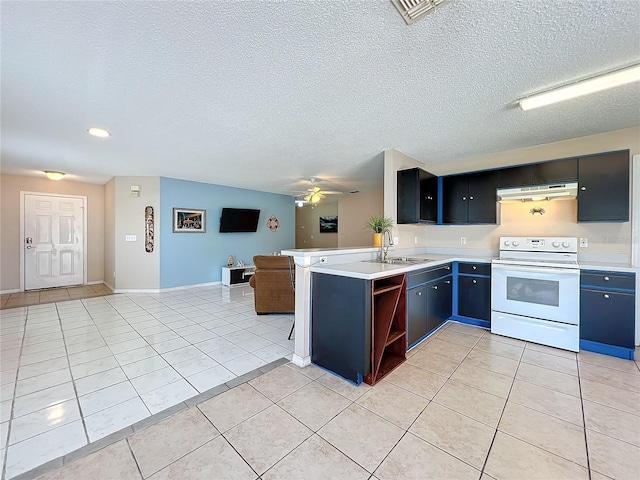 kitchen with light tile patterned flooring, sink, ceiling fan, kitchen peninsula, and white range with electric cooktop