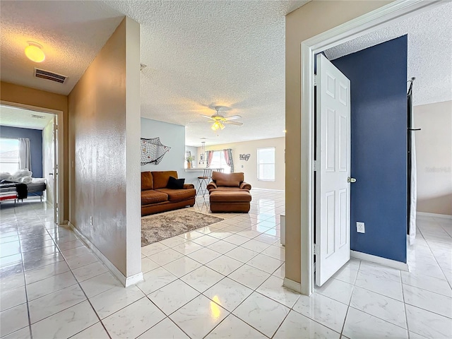 corridor with a textured ceiling