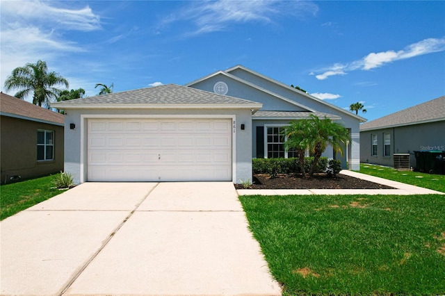 ranch-style house featuring a garage, a front lawn, and central air condition unit