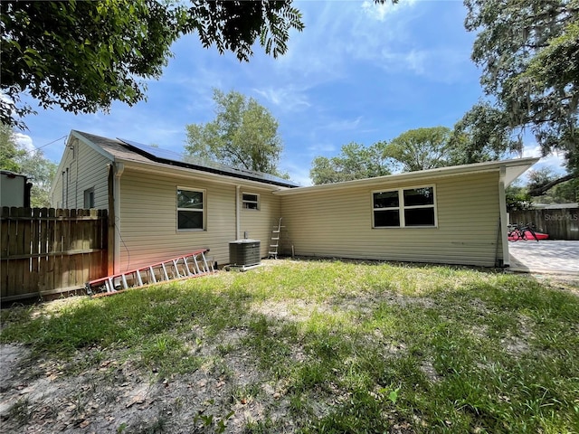 back of property featuring central AC unit