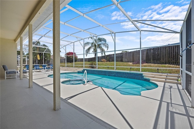 view of swimming pool with a lanai and a patio area