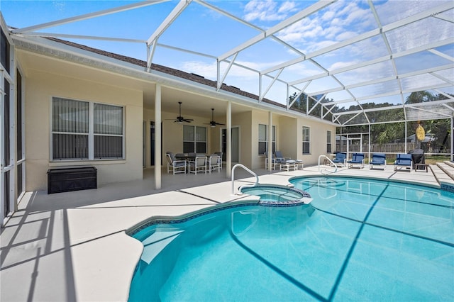 view of pool with ceiling fan, a lanai, and a patio