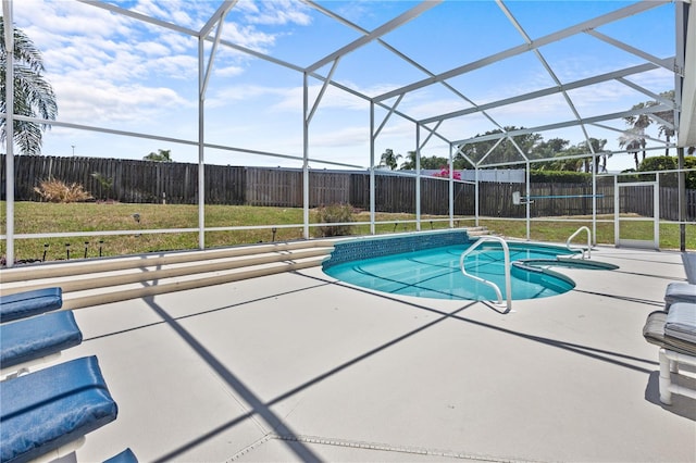 view of pool featuring a lanai, a patio area, and a lawn