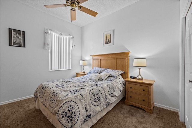 bedroom with dark carpet, ceiling fan, and a textured ceiling