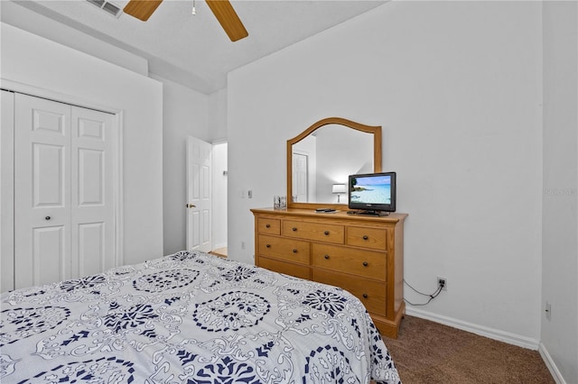 carpeted bedroom featuring a closet and ceiling fan