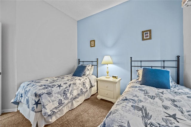 bedroom with carpet and lofted ceiling