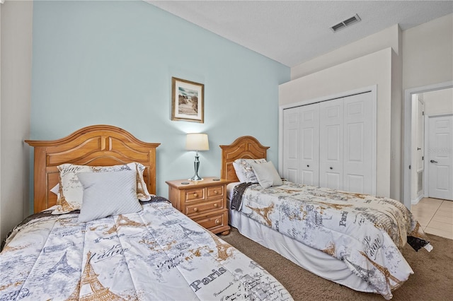 carpeted bedroom featuring a closet