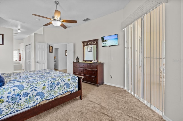 carpeted bedroom featuring ensuite bathroom and ceiling fan