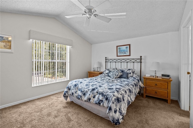 carpeted bedroom featuring a textured ceiling, ceiling fan, and vaulted ceiling