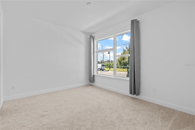 unfurnished room with carpet