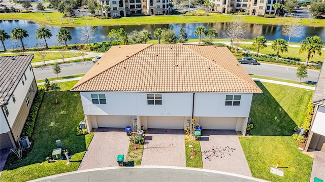 birds eye view of property featuring a water view