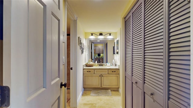 bathroom with tile floors and vanity