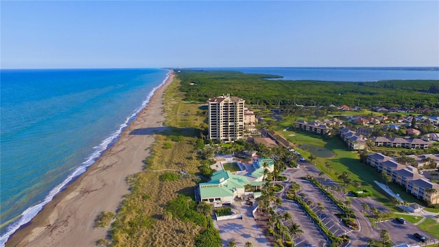 birds eye view of property with a view of the beach and a water view