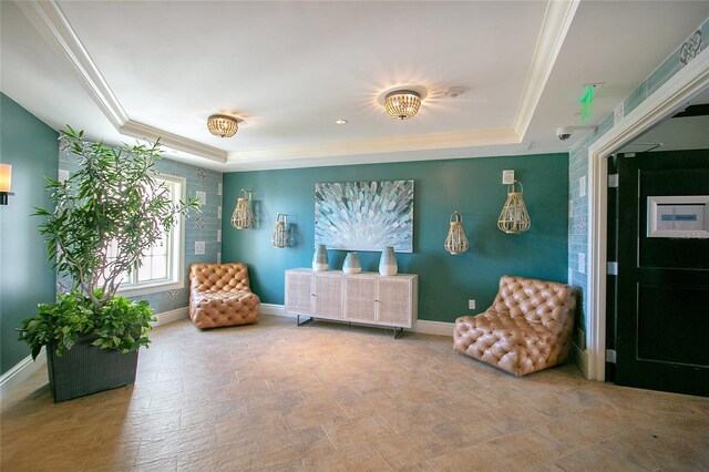 living area with a raised ceiling