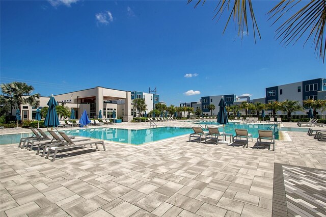 view of swimming pool with a patio area