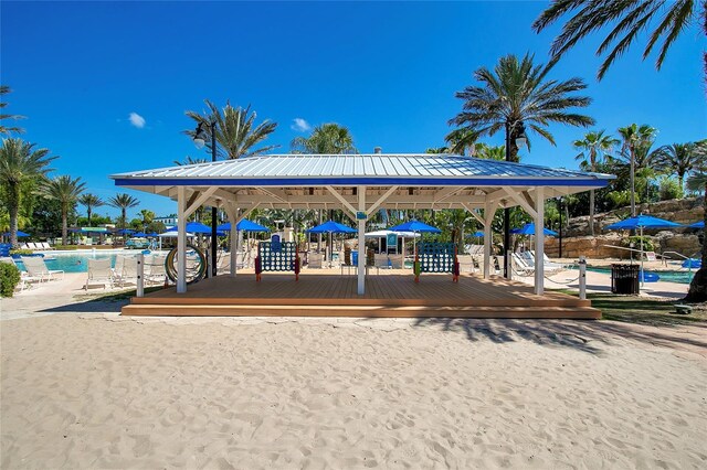 view of jungle gym with a gazebo and a community pool