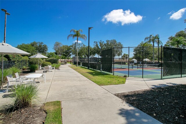 view of community with tennis court