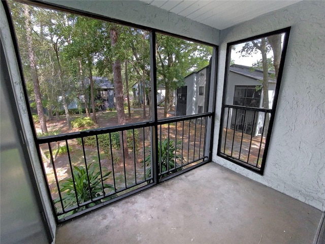 unfurnished sunroom featuring a wealth of natural light