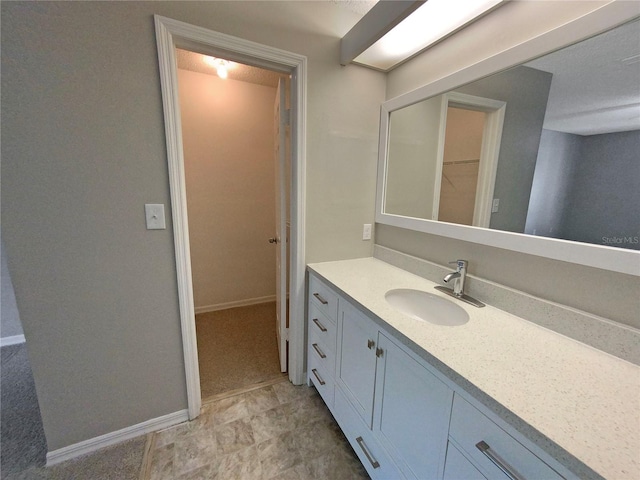 bathroom featuring tile floors and large vanity