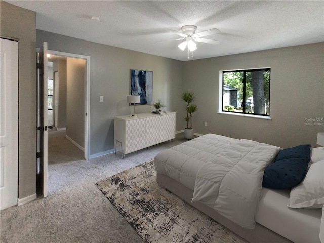 carpeted bedroom featuring a textured ceiling and ceiling fan