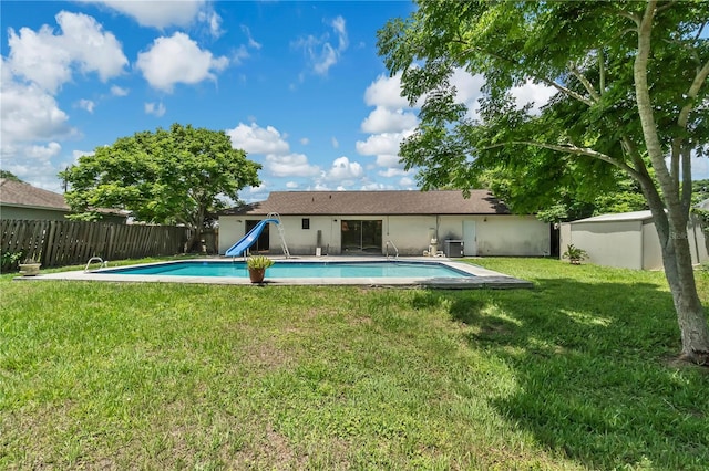 exterior space featuring a lawn and a water slide