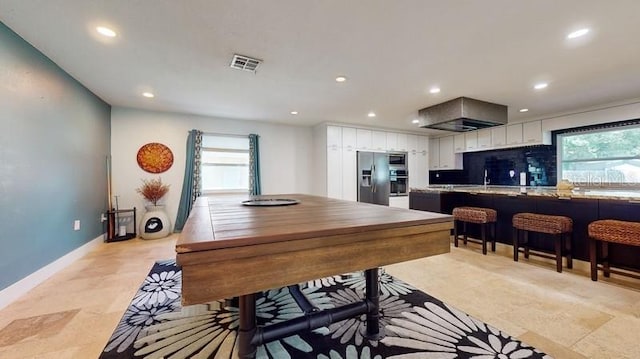 recreation room featuring light tile flooring