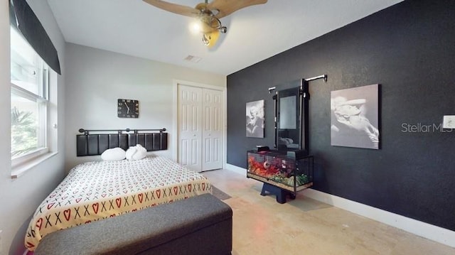 carpeted bedroom with a closet and ceiling fan