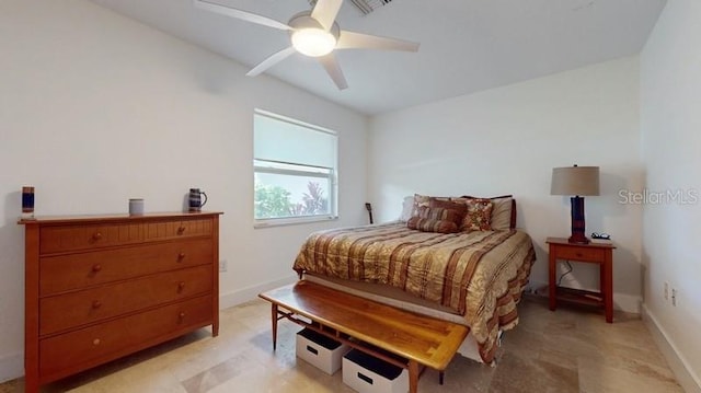 bedroom with ceiling fan and light tile floors