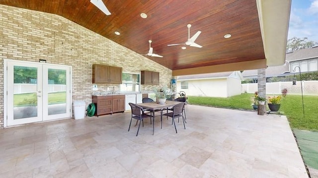 view of patio featuring sink, french doors, and ceiling fan