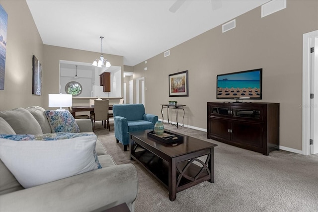 carpeted living room featuring ceiling fan