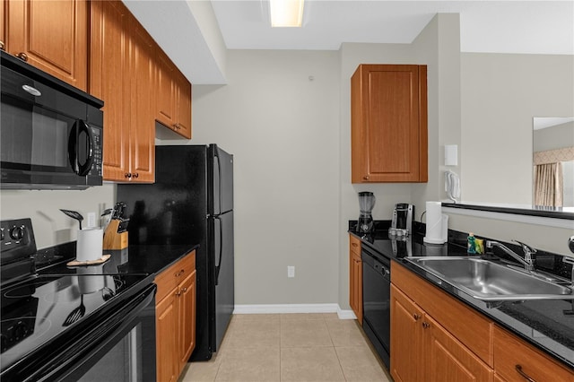 kitchen featuring dark stone counters, sink, light tile flooring, and black appliances