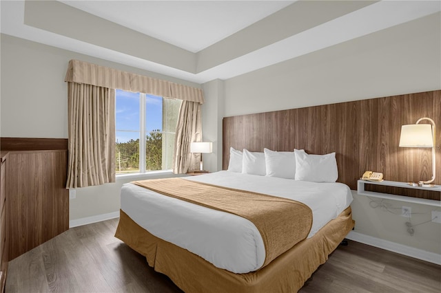 bedroom featuring dark hardwood / wood-style flooring