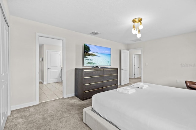 carpeted bedroom featuring a closet