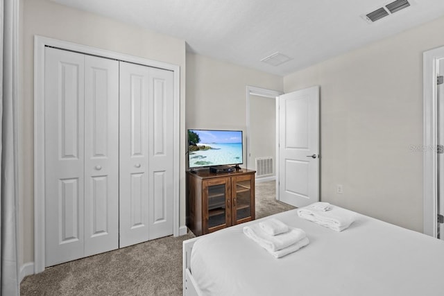 carpeted bedroom with a closet